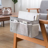 Baby bed organizer with diaper and toy storage capabilities
