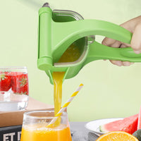 Manual lemon juicer in green