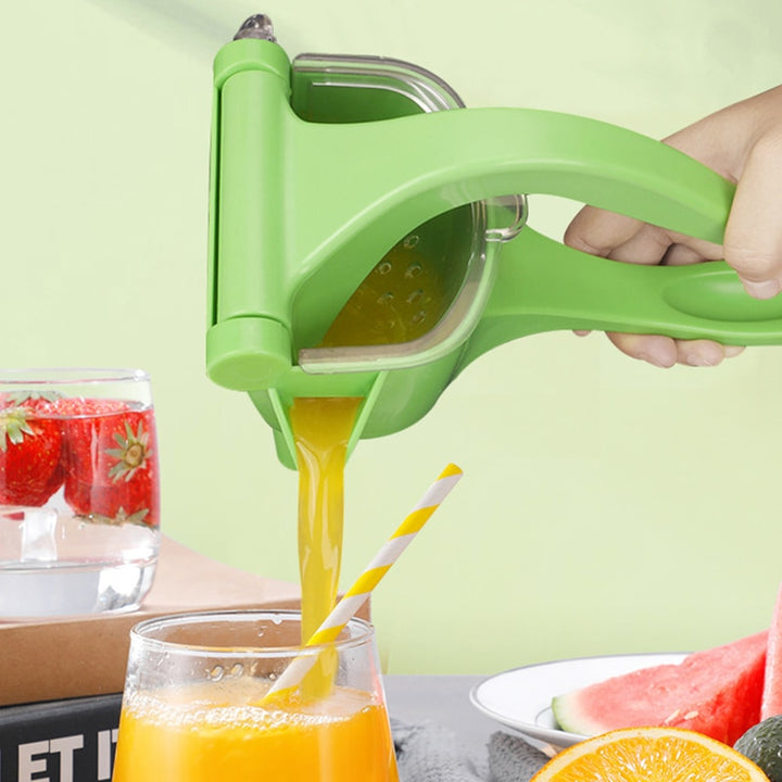 Manual lemon juicer in green