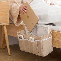 Baby bed organizer with diaper and toy storage capabilities