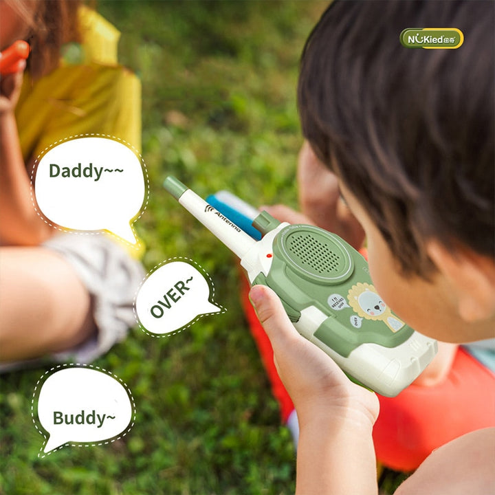 Kids using walkie talkies outdoors