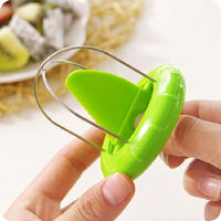 Stainless steel fruit cutter with ergonomic design.