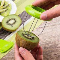 Stainless steel fruit cutter with ergonomic design.