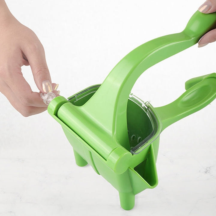 Manual lemon juicer in green